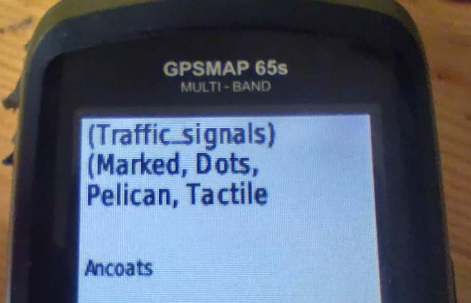 A picture of a Garmin handheld saying "(traffic_signals) (marked, dots, pelican, tactile"